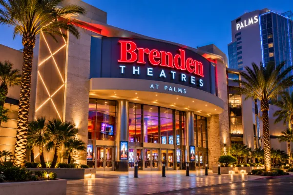 AI illustration of Brenden Theatres at Palms Casino Resort in Las Vegas, featuring an illuminated movie theater entrance.