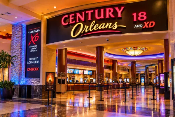 Illustration of Century Orleans 18 and XD with its illuminated cinema entrance and spacious lobby.